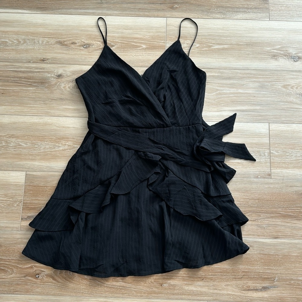 Francesca’s NWT black ruffle mini dress with adjustable straps and waist tie